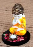 Handcrafted Little Baby Monk with Tealight Holder Wooden Base Decorative Showpiece - 22 cm (Poly resin, Multicolor)